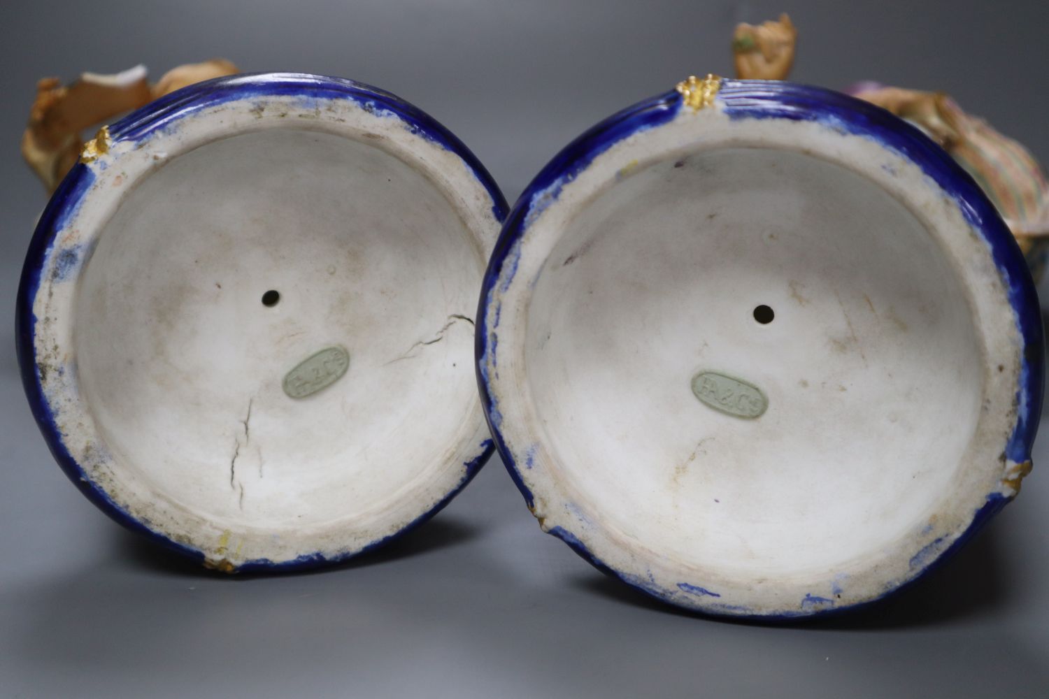 A pair of 19th century coloured bisque porcelain Oriental figures, height 38cm